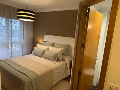 a bedroom with a bed with pillows on it at #Las Azaleas# in Teijois
