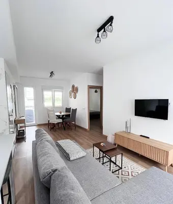 a living room with a couch and a table at Eneas I , II in A Pontenova