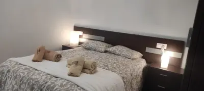 a bedroom with a bed with two pillows on it at As pitas 2 in Tapia de Casariego