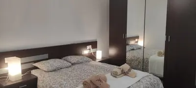 a hotel room with two beds and a mirror at As pitas 2 in Tapia de Casariego