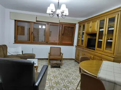a living room with a couch and a table at As pitas 2 in Tapia de Casariego