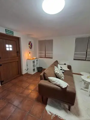 a living room with a couch and a table at As Pitas 4B in Tapia de Casariego