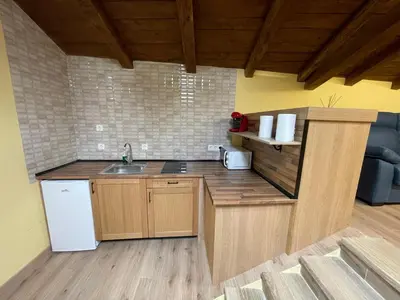 a kitchen with a sink and a counter top at Apartamentos Rurales Casa Carloto