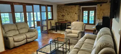 a living room with couches and chairs and a table at VUT 85 Teclas in Puebla de Sanabria