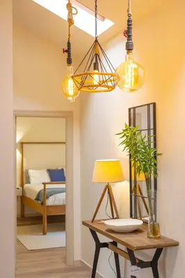 a room with a table with a lamp and a bed at Luz Marina in Ribadeo