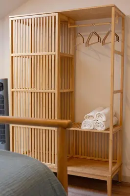 a wooden bunk bed with towels in a room at Luz Marina in Ribadeo