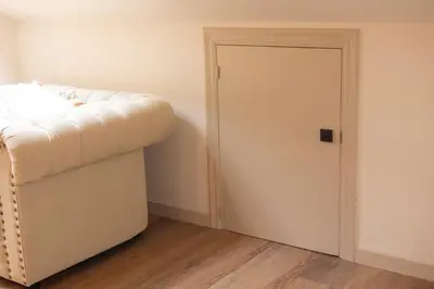 a room with a white door and a bed at Luz Marina in Ribadeo
