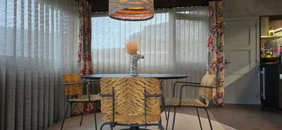 a table with a vase on it in a room at Galician Stone House Santiago in Ramallosa