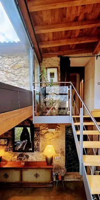 a room with a staircase and a stair case at Galician Stone House Santiago in Ramallosa