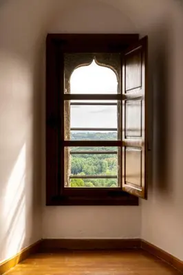 an open window in a room with a wooden floor at Parador de Vilalba in Villalba