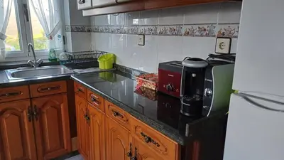 a kitchen with a sink and a counter top at Vivienda vacacional Casa Rubieiro