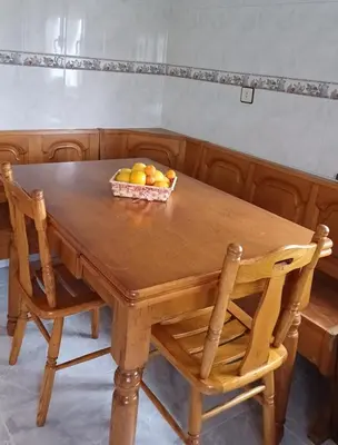 a wooden table with a bowl of fruit on it at Vivienda vacacional Casa Rubieiro