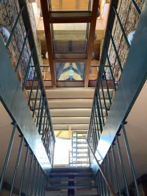 an overhead view of a staircase with a stained glass window at Ahío San Martín, Apartamentos Rurales Casa de la Villa in San Martín de Oscos