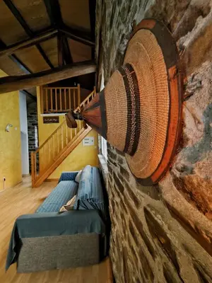 a room with a wall with a large coil of rope at 39A01 La Casita Olga Casa en plena naturaleza by R2R Consulting in Arrojo