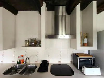 a kitchen with a sink and a microwave at 39A01 La Casita Olga Casa en plena naturaleza by R2R Consulting in Arrojo