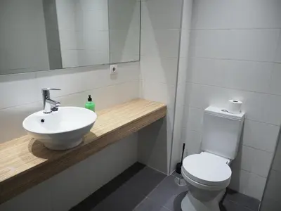a bathroom with a sink and a toilet at Rúa Mariñeiro in Burela de Cabo