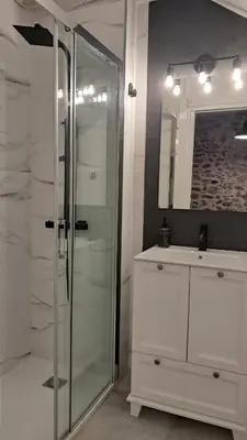 a bathroom with a glass shower and a sink at Casa Loma Lola in Molinaseca