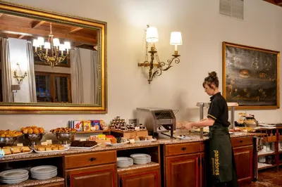 a man standing in a kitchen preparing food at Parador de Verín in Monterrei