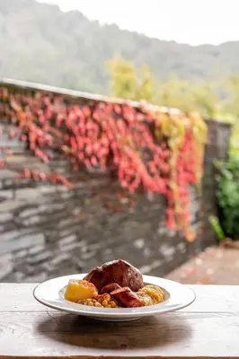 a plate of food sitting on a table at Parador de Villafranca del Bierzo in Villafranca del Bierzo