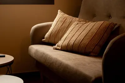a pillow sitting on a chair in a room at Apartamentos turísticos en la naturaleza in Barreiros