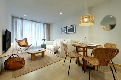 a living room with a couch and a table at Vita Homes by Upper Luxury Housing in Santiago de Compostela