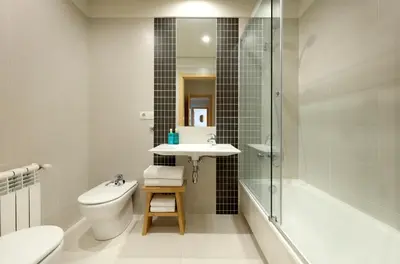 a bathroom with a sink and a toilet and a shower at Vita Homes by Upper Luxury Housing in Santiago de Compostela