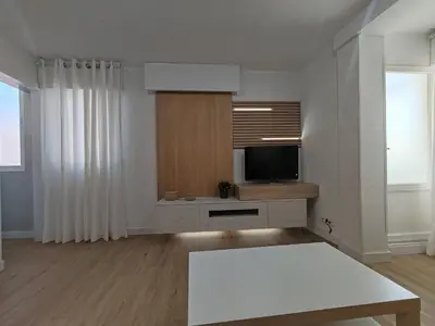 a living room with a tv and a table at Night Day in Padrón