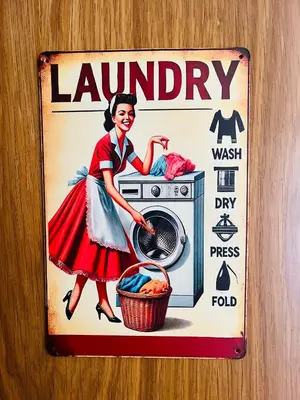 an old laundry sign on a bathroom door at Casa Naveira vistas mar en Foz in Foz