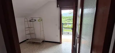 a room with a door open to a balcony at Casa Julia in Barreiros