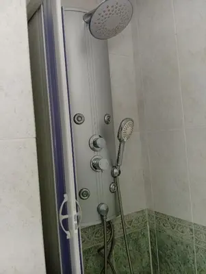 a shower with a shower head in a bathroom at Fonteculler centro in Culleredo