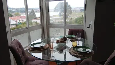 a dining room table with chairs and a glass table at Fonteculler centro in Culleredo