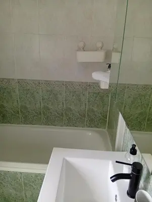 a bathroom with a sink and a bath tub at Fonteculler centro in Culleredo