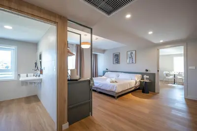 a bedroom with a bed and a sink in a room at SNÖ Porta das Fragas in A Capela