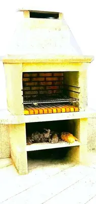 a brick oven with different types of food inside at La Casa del Bosque del Agua y SPA Prexigueiro Obsequio entrada por persona a circuito termal in Mondariz