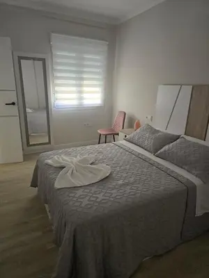 a bedroom with a bed with a towel on it at Piso Bedoya in Ourense