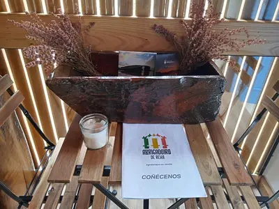 a table with a glass of milk and a basket of plants at Suit Cabozo de Rexa in Barral