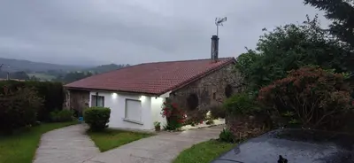 a small white house with a red roof at Casa Vaz in A Estrada