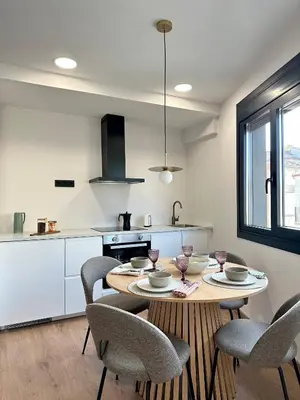 a kitchen with a table and chairs in a kitchen at Lemos Mel in Monforte de Lemos