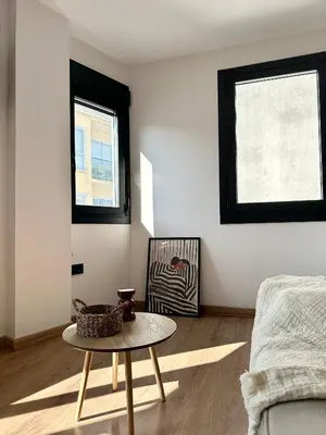 a living room with a table and a couch at Lemos Mel in Monforte de Lemos