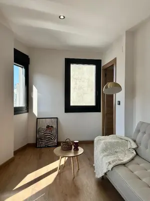 a living room with a couch and a table at Lemos Mel in Monforte de Lemos
