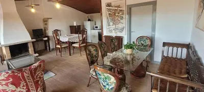 a living room with a glass table and chairs at Casa Otero in Serode