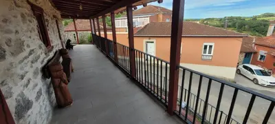 a balcony of a house with a view of a car at Casa Otero in Serode