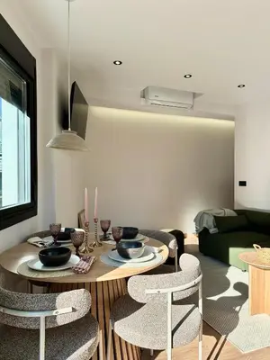 a living room with a table and chairs at Lemos Lar in Monforte de Lemos