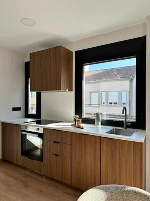 a kitchen with a sink and a window at Lemos Lar in Monforte de Lemos