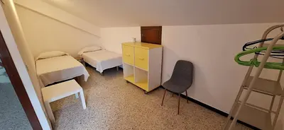 a bedroom with a bed and a dresser and a mirror at Casa Julia, primera línea de playa junto a las Catedrales in San Miguel Reinante
