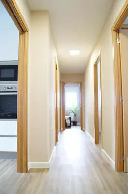 a hallway of a house with a kitchen and a living room at Fin del Camino in Santiago de Compostela