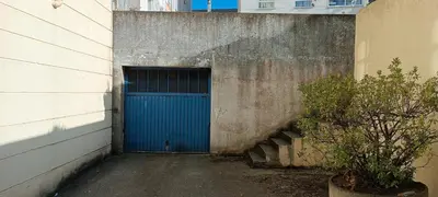 a blue door in the side of a building at Manisa I in Ribadeo