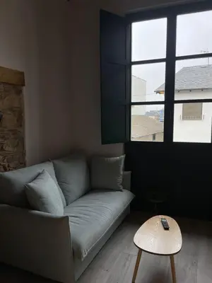 a living room with a couch and a table at El Granado in Cacabelos