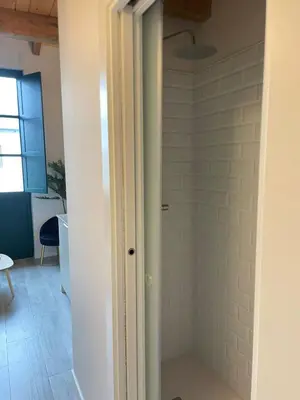 a bathroom with a shower with a glass door at El Granado in Cacabelos