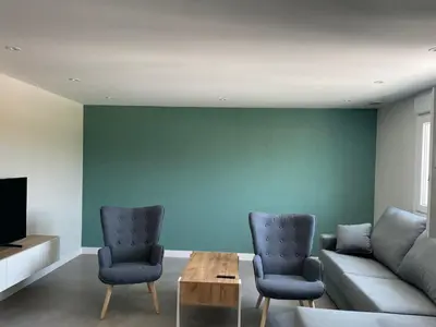 a living room with a couch and two chairs at La casita de Pepa in Caldas de Reis